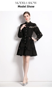 Detail of hollow-out lace patterns and stand collar on this black long sleeve dress