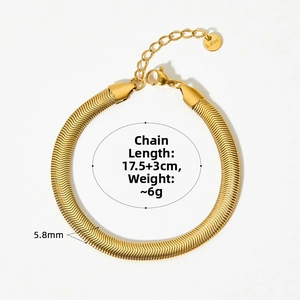 Detail of golden stainless steel flat snake chain bracelet with lobster clasp and tag