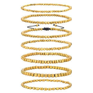 7-piece set of gold-beaded bracelets with faceted hematite and adjustable black cord knots