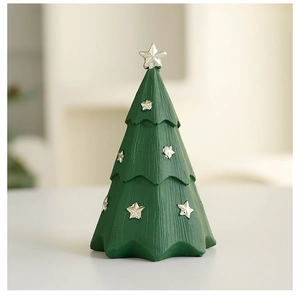 Macro detail of a resin Christmas tree figurine with silver stars and vertical textures