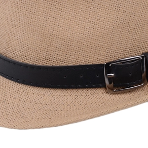 Detailed macro shot of straw fedora hat texture with black leather belt and silver buckle