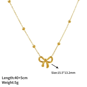 Elegant 18K gold butterfly necklace with minimalist metallic beads on a delicate chain