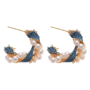 Elegant C-shaped earrings with gold metal base, blue denim fabric and white pearls