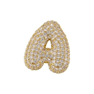 Gold balloon-style letter A pendant with sparkling round zircons on white background