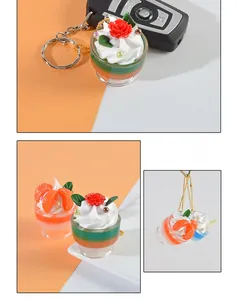 Detailed view of mini cream sundae keychain with resin fruits and colorful layers