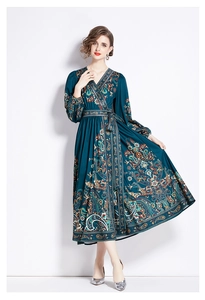 Detail of V-neck paisley print wrap dress with long lantern sleeves and waist tie