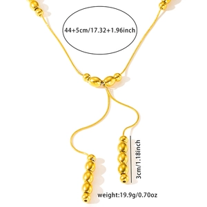 Detail view of gold bead necklace showing 49cm chain length and 3cm fringe pendant