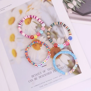 Bohemian colorful heishi bead bracelets with smiley face and heart charms set of four