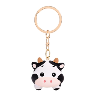 Cute cartoon cow keychain with black and white spots and gold ring for bag decoration