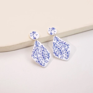 Detail of rhombic blue leaf porcelain earrings with artistic Chinese retro pattern