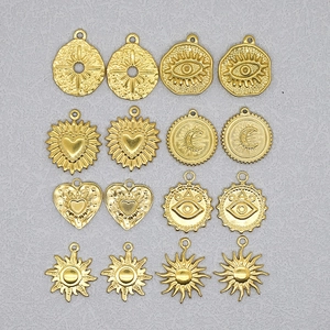 16-piece set of gold stainless steel charms with celestial sun and heart patterns