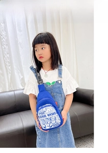 Detail of blue kids crossbody bag with cartoon doodle print and adjustable strap