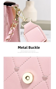 Detail of pink heart-quilted handbag showing gold metal lobster clasp and magnetic closure