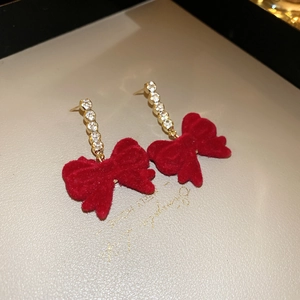 Elegant red flocked bow earrings with gold finish and sparkling zircon stones