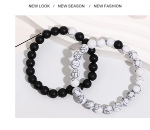 Detail view of matte black agate and white turquoise beaded bracelets for couples