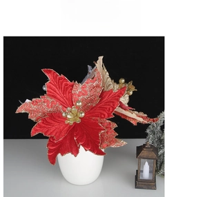 Detailed view of red and champagne velvet poinsettia flowers with gold glitter accents