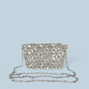Detailed view of silver metallic beaded crossbody bag with handwoven mesh texture