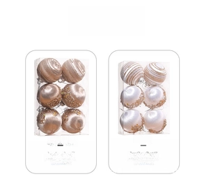 Detail of rose gold and white foam Christmas balls with glitter swirls and sequins