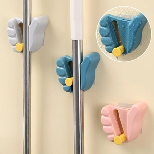 Adjustable wall-mounted mop holder with hand-shaped hooks in grey, blue, and pink colors