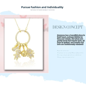 Macro detail of custom gold plated necklace with cz paved boy and girl charms
