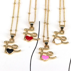 Detail of Fe letter necklaces with colorful enamel hearts and gold beaded chains