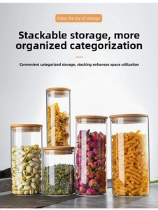 Detail of airtight glass storage jars with bamboo lids showing five various sizes