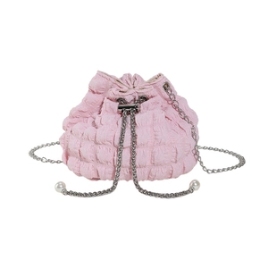 Pink pleated fabric bucket bag with silver chain strap and pearl details on white background
