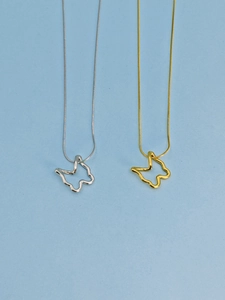 Detailed view of cutout butterfly pendant necklaces in gold and silver finish with snake chains