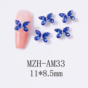 Vue détaillée de bijoux d'ongles papillon 3D bleu saphir avec dimensions 11x8,5 mm