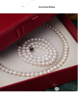 Macro shot of natural freshwater pearl necklace in a classic red velvet jewelry gift box