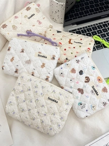 Quilted floral makeup bag with bear and dog patterns for portable cosmetic storage