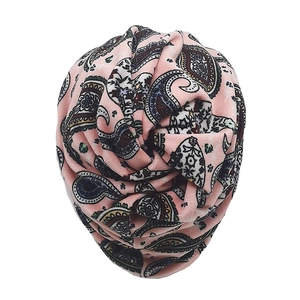 Detail of pink paisley velvet headwrap featuring intricate floral patterns and soft texture