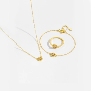 Detail of S925 sterling silver jewelry set featuring smiley pendants with inlaid crystals