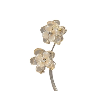 Minimalist camellia flower hair claw clip with cream resin petals and sparkling rhinestones