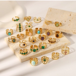 Detailed close-up of 18k gold plated stainless steel rings with colorful natural stones