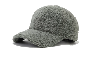Close-up of soft grey lamb wool baseball cap texture with warm fuzzy fabric detail