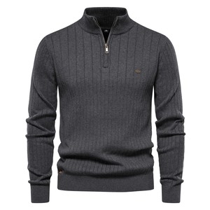 Detailed view of dark grey men's knit sweater with quarter-zip collar and ribbed texture