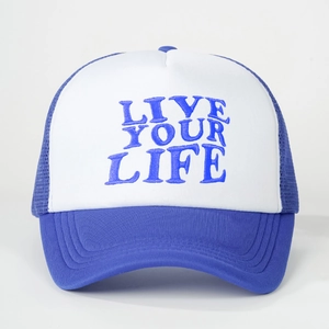 Royal blue and white trucker hat with embroidered Live Your Life text on front crown