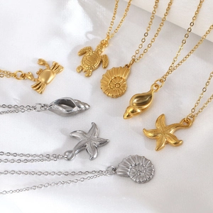 Elegant stainless steel ocean theme necklaces featuring starfish and crab sea charms