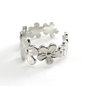 Adjustable silver stainless steel open ring featuring a minimalist floral daisy design