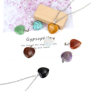 Natural gemstone heart pendants on silver chains including amethyst and turquoise