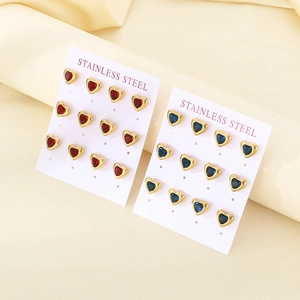 Detailed view of red and blue heart-shaped stainless steel stud earring sets on cards