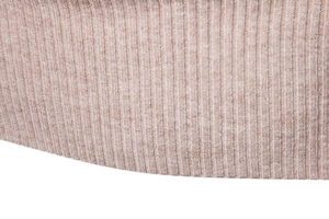 Close-up of oatmeal rib knit fabric showing soft texture and premium vertical grain