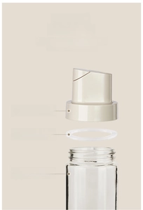 Detail of glass oil bottle showing lead-free body and leakproof silicone sealing ring