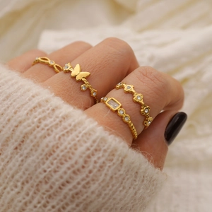 Elegant gold-plated butterfly and chain ring set with diamonds on model's hand