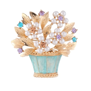 Vintage style floral basket brooch featuring white pearls and colorful rhinestones