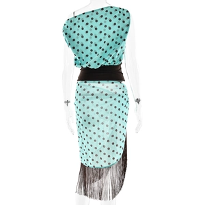 Back view of light blue polka dot sleeveless top and matching skirt with long black tassels