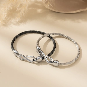 Minimalist stainless steel cable bracelets in black and silver with unique hook clasps