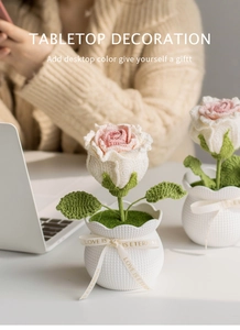 Handmade crochet rose potted plant on office desk with Love Is Eternal ribbon detail