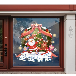 Detail of Christmas window stickers featuring Santa, reindeer, and tree on a glass shop front